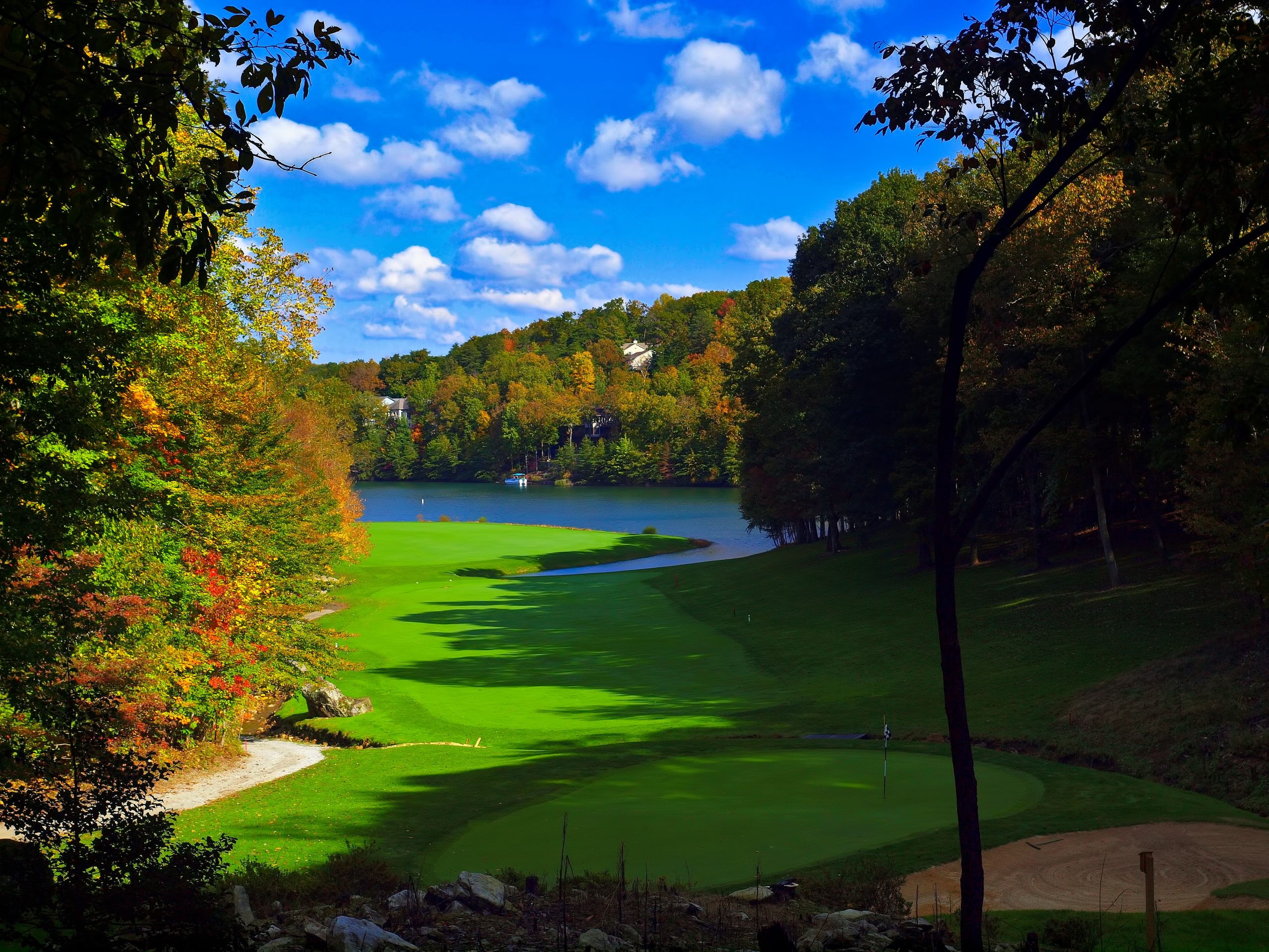 Scenic golf course overlooking a lake surrounded by fall foliage in Fairfield Glade, Tennessee